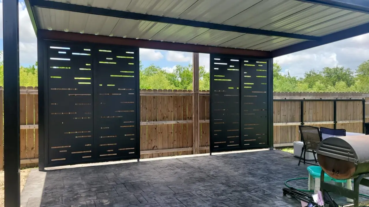 Black privacy screens under patio roof