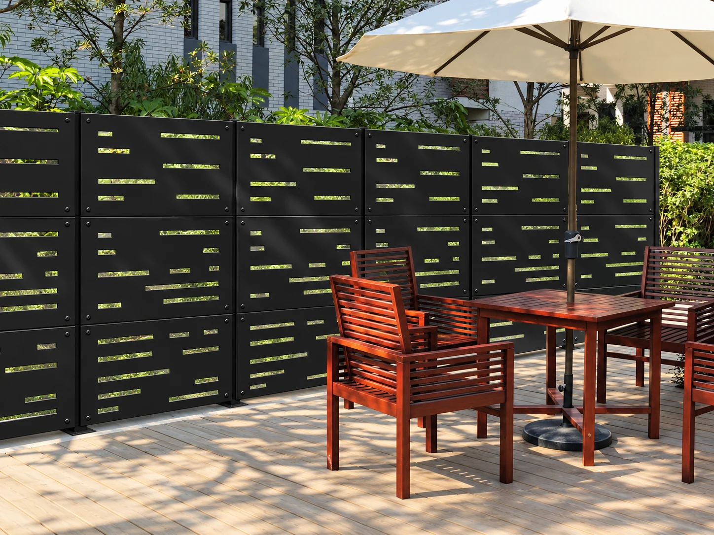 Modern black LatticeSmart privacy panels behind an outdoor dining area